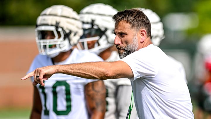 Michigan State's defensive coordinator Joe Rossi works with the defense during the first day of football camp on Tuesday, July 30, 2024, in East Lansing.