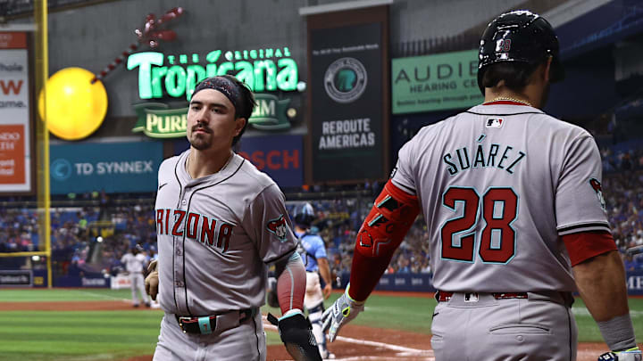 Aug 18, 2024; St. Petersburg, Florida, USA;  Arizona Diamondbacks outfielder Corbin Carroll (7) is congratulated by third base Eugenio Suarez (28) after he hit a 2-run home run against the Tampa Bay Rays during the eighth inning at Tropicana Field. Mandatory Credit: Kim Klement Neitzel-Imagn Images