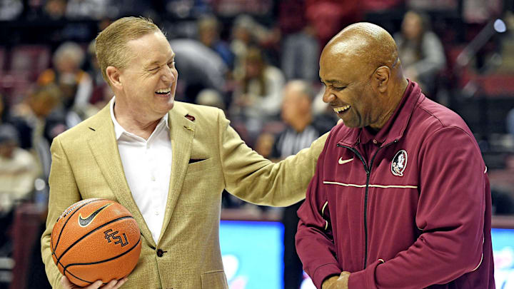 Jan 14, 2023; Tallahassee, Florida, USA; Florida State Seminoles athletic director Michael Alford gives head coach Leonard Hamilton a special recognition for his 600th career win before the game against the Virginia Cavaliers at Donald L. Tucker Center. Mandatory Credit: Melina Myers-Imagn Images