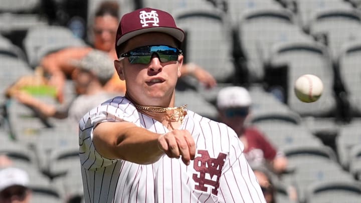Mississippi State third baseman Ace Reese (3) fields a bunt by Texas A&M second baseman Ben Royo (10) but makes a wild throw to first in the first round of the SEC Baseball Tournament at the Hoover Met. Mississippi State third baseman Ace Reese (3) fields a bunt by Texas A&M second baseman Ben Royo (10) but makes a wild throw to first in the first round of the SEC Baseball Tournament at the Hoover Met.