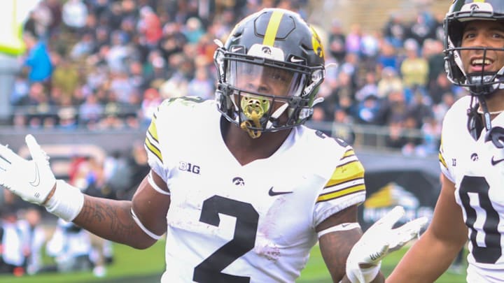 Kaleb Johnson (2) and Diante Vines (0) celebrate a TD during the NCAA football game, Saturday, Nov. 5, 2022, at Ross-Ade Stadium in West Lafayette, Ind. Iowa won 24-3.