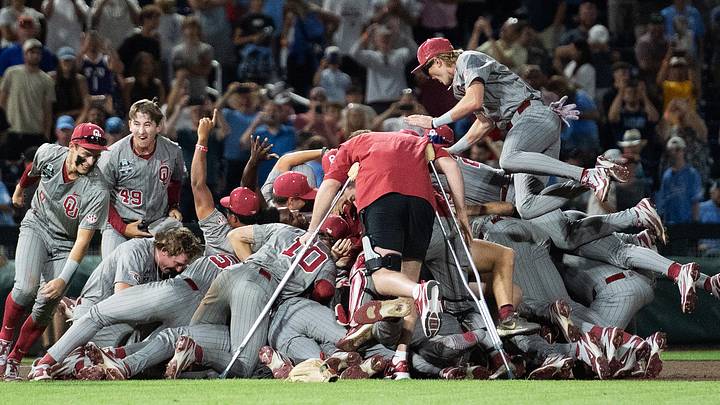 The Oklahoma Sooners celebrate the national championship following a 13-2 win over the North Carolina Tar Heels at Charles Schwab Field in Omaha. 