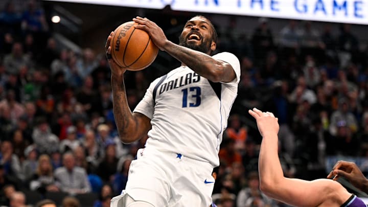 Jan 17, 2026; Dallas, Texas, USA; Dallas Mavericks forward Naji Marshall (13) drives to the basket past Utah Jazz guard Walter Clayton Jr. (13) during the second half at the American Airlines Center. Mandatory Credit: Jerome Miron-Imagn Images
