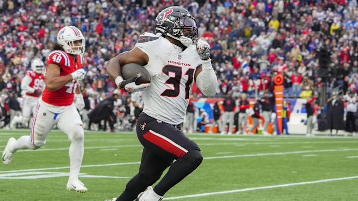 Oct 13, 2024; Foxborough, Massachusetts, USA; Houston Texans running back Dameon Pierce (31) runs with the ball for a touchdown against the New England Patriots during the second half at Gillette Stadium. Mandatory Credit: Gregory Fisher-Imagn Images