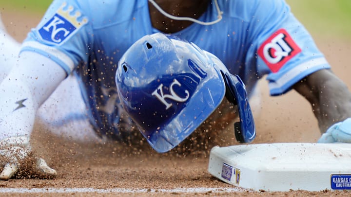 Aug 13, 2025; Kansas City, Missouri, USA; Kansas City Royals second baseman Tyler Tolbert (2) loses his helmet as he steals third base during the eighth inning against the Washington Nationals at Kauffman Stadium. Mandatory Credit: Jay Biggerstaff-Imagn Images