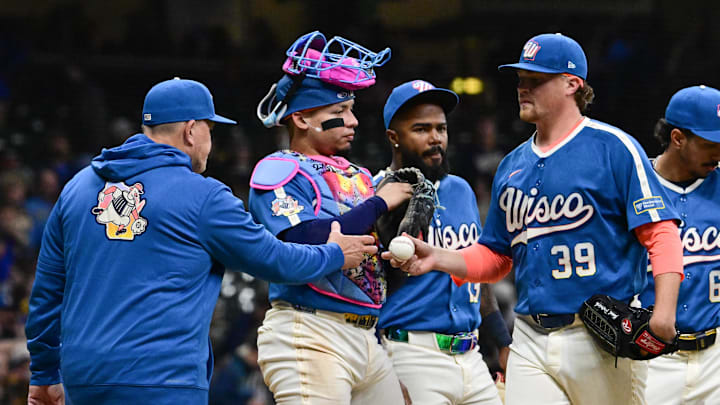 Apr 10, 2026; Milwaukee, Wisconsin, USA; Milwaukee Brewers pitcher Chad Patrick (39) hands the ball to manager Pat Murphy during a pitching change in the sixth inning against the Washington Nationals at American Family Field. Mandatory Credit: Benny Sieu-Imagn Images