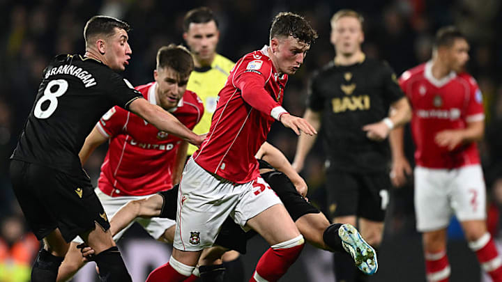 Nathan Broadhead (middle) delivered all three points for Wrexham on Wednesday night.