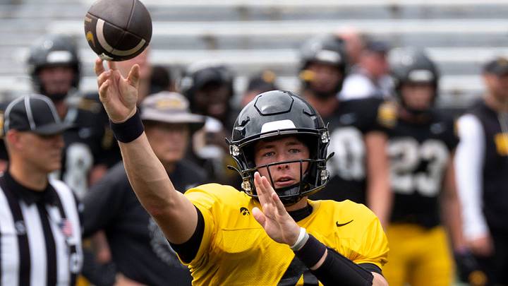 Iowa quarterback Tradon Bessinger (4) passes the football Aug. 15, 2026 during the Kids Day at Kinnick open practice at Kinnick Stadium in Iowa City, Iowa. Iowa quarterback Tradon Bessinger (4) passes the football Aug. 15, 2026 during the Kids Day at Kinnick open practice at Kinnick Stadium in Iowa City, Iowa.