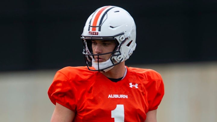 Auburn Tigers quarterback Payton Thorne (1) talks with quarterbacks coach Kent Austin during