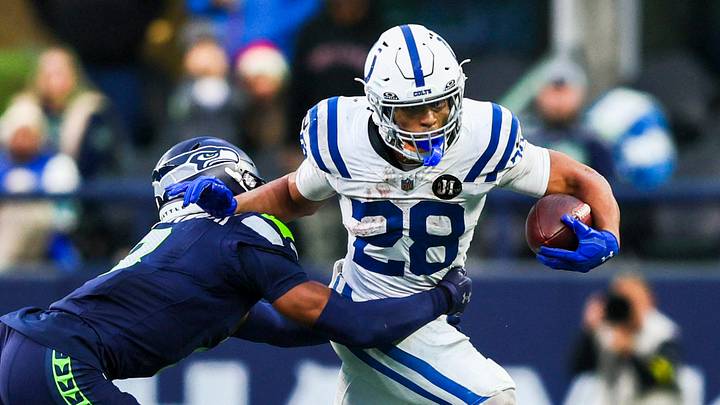 Dec 14, 2025; Seattle, Washington, USA; Indianapolis Colts running back Jonathan Taylor (28) rushes against the Seattle Seahawks during the second half at Lumen Field. Mandatory Credit: Kevin Ng-Imagn Images