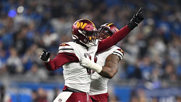 Jan 18, 2025; Detroit, Michigan, USA; Washington Commanders linebacker Dante Fowler Jr. (6) celebrates a recovered fumble with defensive tackle Jonathan Allen (93) during the first quarter against Detroit Lions in a 2025 NFC divisional round game at Ford Field. Mandatory Credit: Lon Horwedel-Imagn Images