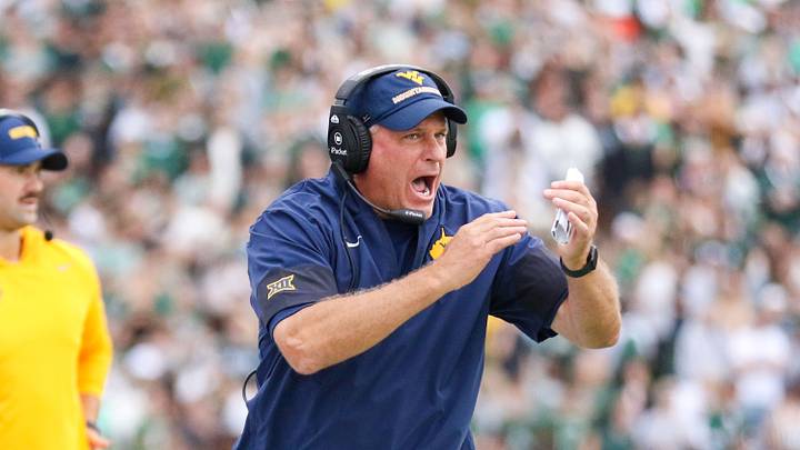 Sep 6, 2025; Athens, Ohio, USA; West Virginia Mountaineers head coach Rich Rodriguez calls a timeout during the second quarter against the Ohio Bobcats at Peden Stadium. Mandatory Credit: Ben Queen-Imagn Images
