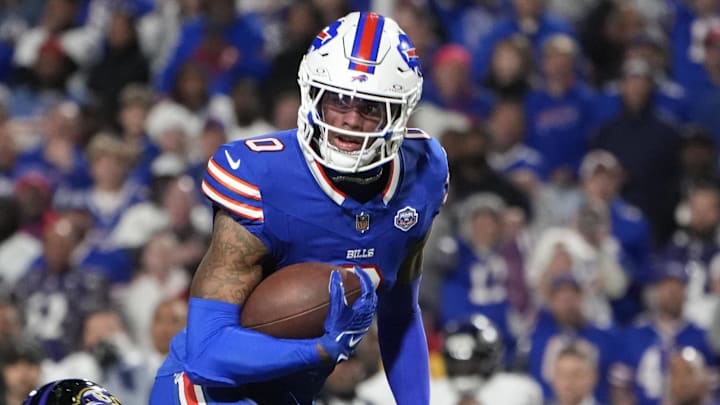 Buffalo Bills wide receiver Keon Coleman (0) runs the ball against Baltimore Ravens cornerback Jaire Alexander (23) during the fourth quarter at Highmark Stadium. 