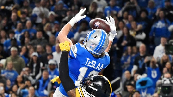 Dec 21, 2025; Detroit, Michigan, USA; Detroit Lions wide receiver Isaac Teslaa (18) attempts to catch a game winning pass but fails against Pittsburgh Steelers safety Chuck Clark (21) during the fourth quarter at Ford Field. Mandatory Credit: Lon Horwedel-Imagn Images