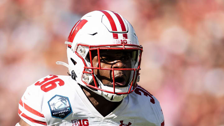Jan 1, 2024; Tampa, FL, USA; Wisconsin Badgers linebacker Jake Chaney (36) reacts after a stop during the first half against the LSU Tigers at Raymond James Stadium. Mandatory Credit: Matt Pendleton-Imagn Images