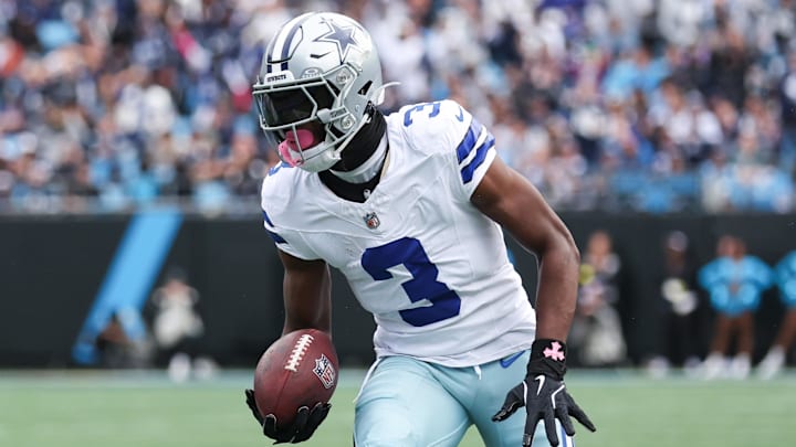 Dallas Cowboys wide receiver George Pickens runs with the ball during the first quarter against the Carolina Panthers at Bank of America Stadium. 