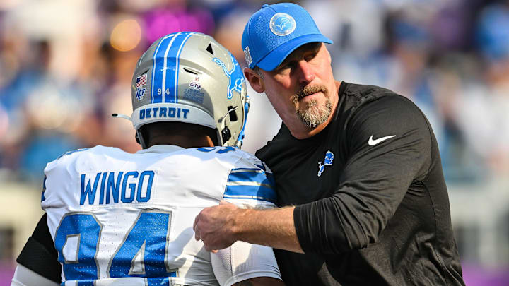 Detroit Lions head coach Dan Campbell greets defensive tackle Mekhi Wingo (94) before the game Minnesota Vikings 