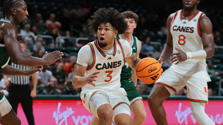 Nov 3, 2025; Coral Gables, Florida, USA; Miami Hurricanes guard Tre Donaldson (3) drives to the basket against the Jacksonville Dolphins during the second half at Watsco Center. Mandatory Credit: Sam Navarro-Imagn Images