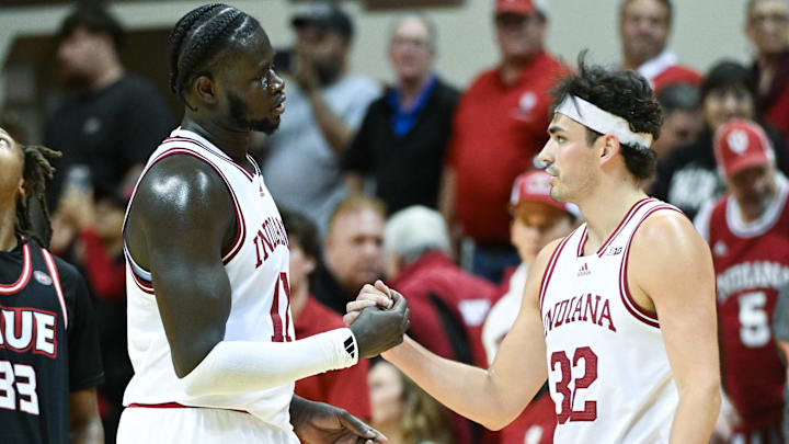 Indiana center Oumar Ballo (11) and guard Trey Galloway (32) celebrate after defeating SIU-Edwardsville at Simon Skjodt Assembly Hall. 