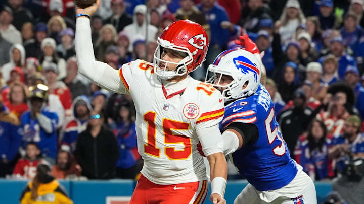 Nov 2, 2025; Orchard Park, New York, USA;  Kansas City Chiefs quarterback Patrick Mahomes (15) is pressured to throw by Buffalo Bills defensive end A.J. Epenesa (57) in the second half at Highmark Stadium. Mandatory Credit: Gregory Fisher-Imagn Images