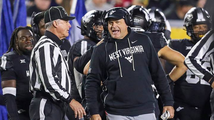 Oct 25, 2025; Morgantown, West Virginia, USA; West Virginia Mountaineers head coach Rich Rodriguez argues a call during the third quarter against the Texas Christian University Horned Frogs at Milan Puskar Stadium. Mandatory Credit: Ben Queen-Imagn Images Oct 25, 2025; Morgantown, West Virginia, USA; West Virginia Mountaineers head coach Rich Rodriguez argues a call during the third quarter against the Texas Christian University Horned Frogs at Milan Puskar Stadium. Mandatory Credit: Ben Queen-Imagn Images