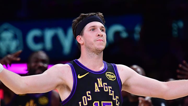 Mar 10, 2026; Los Angeles, California, USA; Los Angeles Lakers guard Austin Reaves (15) reacts after scoring the three point basket and draws the foul against the Minnesota Timberwolves during the second half at Crypto.com Arena. Mandatory Credit: Gary A. Vasquez-Imagn Images