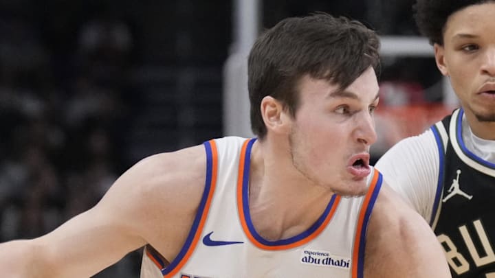 New York Knicks guard Tyler Kolek drives to the basket against Milwaukee Bucks guard Ryan Rollins. New York Knicks guard Tyler Kolek drives to the basket against Milwaukee Bucks guard Ryan Rollins.