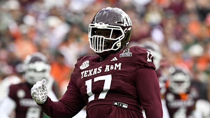 Dec 20, 2025; College Station, TX, USA; Texas A&M Aggies defensive tackle Albert Regis (17) celebrates during the game between the Aggies and the Hurricanes at Kyle Field. Mandatory Credit: Jerome Miron-Imagn Images