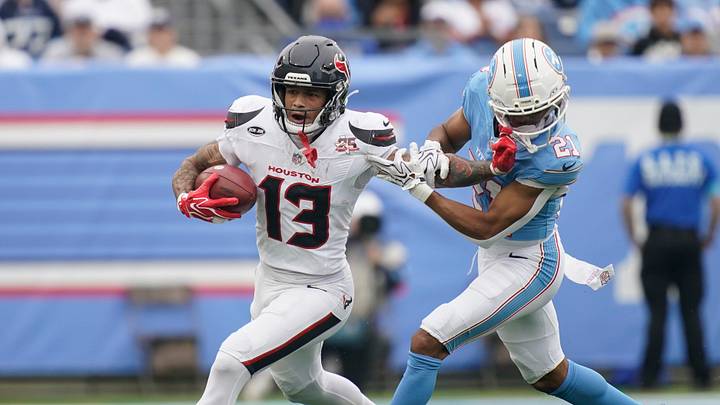 Tennessee Titans cornerback Micah Robinson (21) pushes Houston Texans wide receiver Jaylin Noel (13) out of bounds during the first quarter at Nissan Stadium in Nashville, Tenn., Sunday, Oct. 11, 2026.