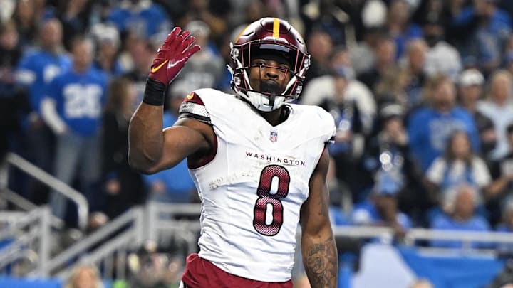 Jan 18, 2025; Detroit, Michigan, USA; Washington Commanders running back Brian Robinson Jr. (8) celebrates a touchdown during the second quarter against Detroit Lions in a 2025 NFC divisional round game at Ford Field. Mandatory Credit: Lon Horwedel-Imagn Images