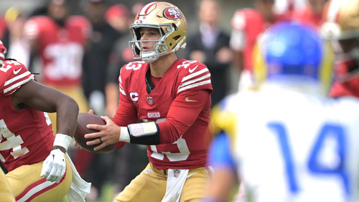 Sep 22, 2024; Inglewood, California, USA;  San Francisco 49ers quarterback Brock Purdy (13) takes a snap in the first half against the Los Angeles Rams at SoFi Stadium. Mandatory Credit: Jayne Kamin-Oncea-Imagn Images