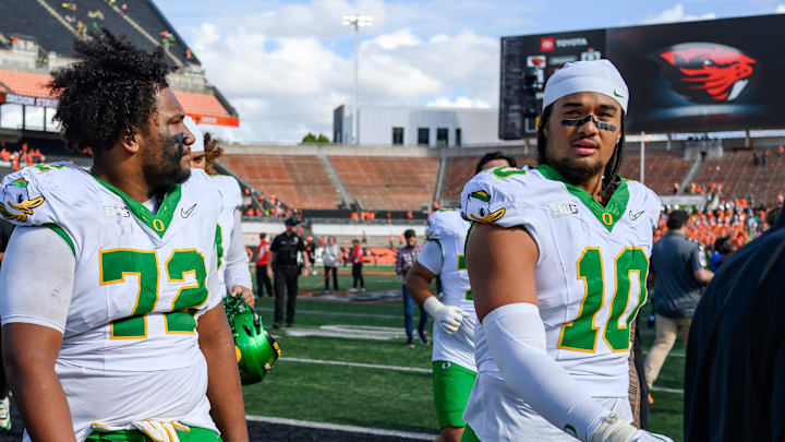 Sep 14, 2024; Corvallis, Oregon, USA; Oregon Ducks offensive lineman Iapani Laloulu (72) and Oregon Ducks defensive end Matayo Uiagalelei (10) leave the field after the game against the Oregon State Beavers at Reser Stadium. Sep 14, 2024; Corvallis, Oregon, USA; Oregon Ducks offensive lineman Iapani Laloulu (72) and Oregon Ducks defensive end Matayo Uiagalelei (10) leave the field after the game against the Oregon State Beavers at Reser Stadium.