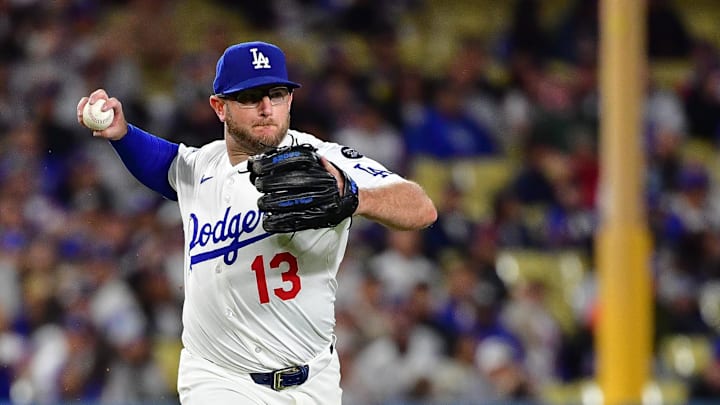 Los Angeles Dodgers third baseman Max Muncy (13) throws to first for the out against New York Mets catcher Francisco Alvarez (4) during the ninth inning at Dodger Stadium on June 3.