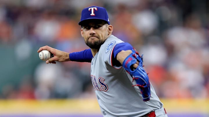 Jul 13, 2025; Houston, Texas, USA; Texas Rangers starting pitcher Nathan Eovaldi (17) delivers a pitch against the Houston Astros during the first inning at Daikin Park.