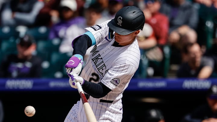 Colorado Rockies left fielder Mickey Moniak (22) hits a solo home run