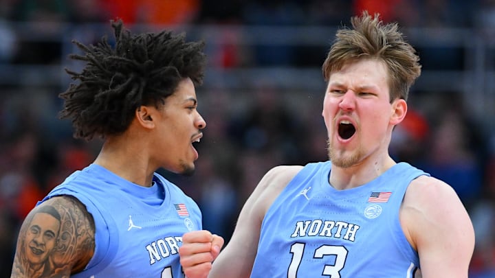 Feb 21, 2026; Syracuse, New York, USA; North Carolina Tar Heels forward Jonathan Powell (11) and center Henri Veesaar (13) react during the second half against the Syracuse Orange at the JMA Wireless Dome. Mandatory Credit: Rich Barnes-Imagn Images Feb 21, 2026; Syracuse, New York, USA; North Carolina Tar Heels forward Jonathan Powell (11) and center Henri Veesaar (13) react during the second half against the Syracuse Orange at the JMA Wireless Dome. Mandatory Credit: Rich Barnes-Imagn Images
