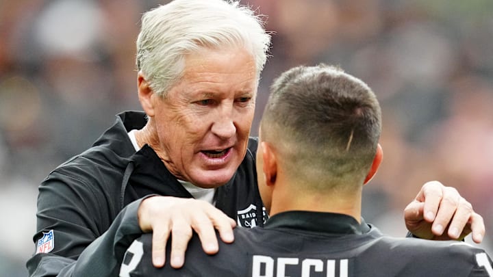 Oct 12, 2025; Paradise, Nevada, USA; Las Vegas Raiders wide receiver Jack Bech (18) and Las Vegas Raiders head coach Pete Carroll talk before the game against the Tennessee Titans at Allegiant Stadium. Mandatory Credit: Stephen R. Sylvanie-Imagn Images