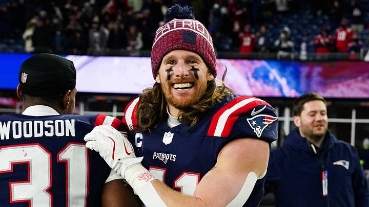 Jan 11, 2026; Foxborough, MA, USA; New England Patriots safety Brenden Schooler (41) and safety Craig Woodson (31) celebrate after defeating the Los Angeles Chargers in an AFC Wild Card Round game at Gillette Stadium. Mandatory Credit: David Butler II-Imagn Images