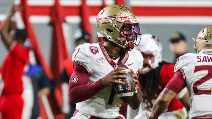 Nov 21, 2025; Raleigh, North Carolina, USA; Florida State Seminoles quarterback Tommy Castellanos (1) with the ball during the first half of the game against NC State Wolfpack at Carter-Finley Stadium. Mandatory Credit: Jaylynn Nash-Imagn Images