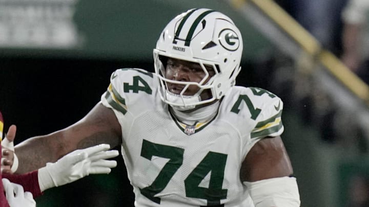 Green Bay Packers center Elgton Jenkins (74) provide pass protection for quarterback Jordan Love vs. Washington. Green Bay Packers center Elgton Jenkins (74) provide pass protection for quarterback Jordan Love vs. Washington.