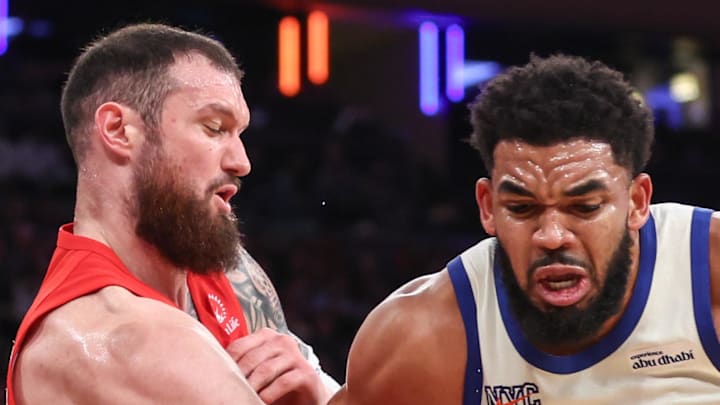 New York Knicks center Karl-Anthony Towns looks to post up against Toronto Raptors forward Sandro Mamukelashvili.