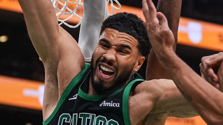 Apr 28, 2026; Boston, Massachusetts, USA; Philadelphia 76ers guard Quentin Grimes (5) and forward Paul George (8) defend against Boston Celtics forward Jayson Tatum (0) in the second half during game five of the first round of the 2026 NBA Playoffs at TD Garden. Mandatory Credit: David Butler II-Imagn Images