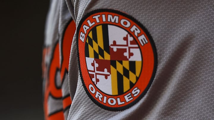 May 5, 2024; Cincinnati, Ohio, USA; The Baltimore Orioles logo on the sleeve of designated hitter Gunnar Henderson (2) as he prepares on deck during the seventh inning against the Cincinnati Reds at Great American Ball Park. Mandatory Credit: Katie Stratman-Imagn Images
