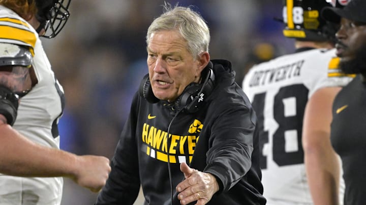Nov 8, 2024; Pasadena, California, USA; Iowa Hawkeyes head coach Kirk Ferentz shakes hands with Iowa Hawkeyes offensive lineman Gennings Dunker (67) after a score in the second half against the UCLA Bruins at the Rose Bowl. Mandatory Credit: Jayne Kamin-Oncea-Imagn Images Nov 8, 2024; Pasadena, California, USA; Iowa Hawkeyes head coach Kirk Ferentz shakes hands with Iowa Hawkeyes offensive lineman Gennings Dunker (67) after a score in the second half against the UCLA Bruins at the Rose Bowl. Mandatory Credit: Jayne Kamin-Oncea-Imagn Images
