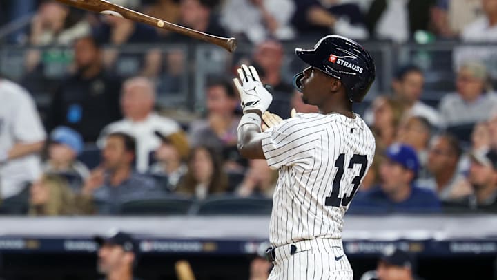 Oct 7, 2025; Bronx, New York, USA; New York Yankees second baseman Jazz Chisholm Jr. (13) hits a solo home run in the fifth inning against the Toronto Blue Jays during game three of the ALDS round for the 2025 MLB playoffs at Yankee Stadium. Mandatory Credit: Vincent Carchietta-Imagn Images