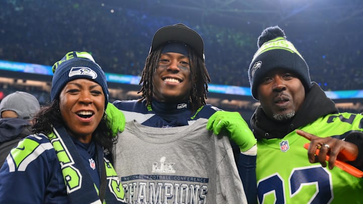 Seattle Seahawks wide receiver Rashid Shaheed (22) celebrates with his parents