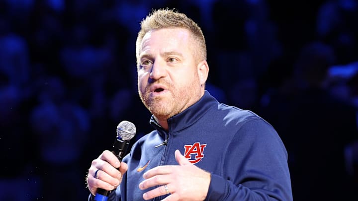 Dec 3, 2025; Auburn, Alabama, USA; Auburn Tigers head football coach Alex Golesh is introduced during the first half of a basketball game between the Auburn Tigers and NC State Wolfpack at Neville Arena. Mandatory Credit: John Reed-Imagn Images Dec 3, 2025; Auburn, Alabama, USA; Auburn Tigers head football coach Alex Golesh is introduced during the first half of a basketball game between the Auburn Tigers and NC State Wolfpack at Neville Arena. Mandatory Credit: John Reed-Imagn Images