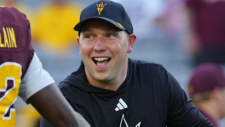 Arizona State head coach Kenny Dillingham high-fives wide receiver Malik McClain (12) during a game at Mountain America Stadium in Tempe, Arizona, on Aug. 30, 2025.