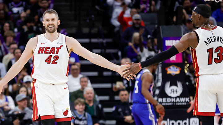 Feb 26, 2024; Sacramento, California, USA; Miami Heat forward Kevin Love (42) celebrates with center Bam Adebayo (13) during the third quarter against the Sacramento Kings at Golden 1 Center. Mandatory Credit: Sergio Estrada-Imagn Images
