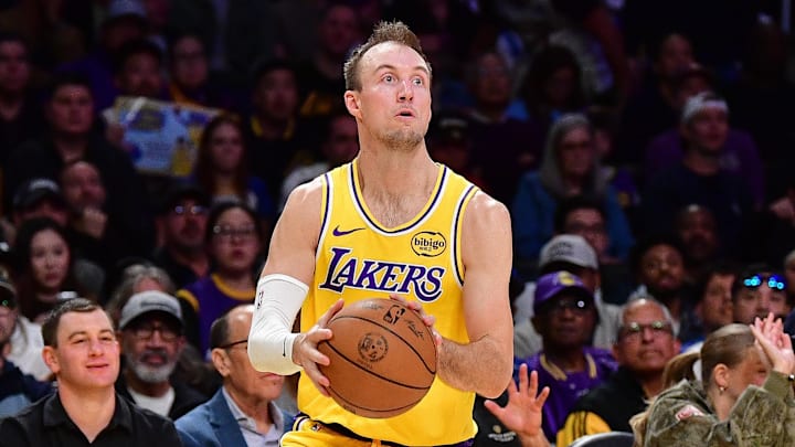 Feb 7, 2026; Los Angeles, California, USA; Los Angeles Lakers guard Luke Kennard (10) shoots against the Golden State Warriors during the first half at Crypto.com Arena. Mandatory Credit: Gary A. Vasquez-Imagn Images